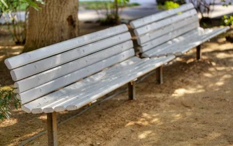 Two white park benches Stock Photos