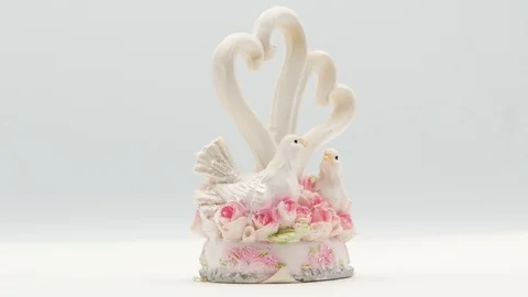 Two white pigeons statuette on white background Stock Footage 108634163