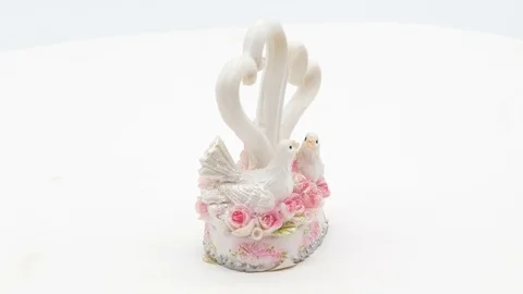 Two white pigeons statuette on white background Stock Footage 108634240