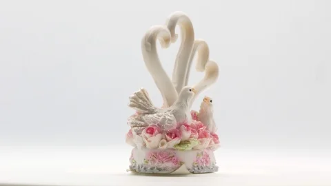Two white pigeons statuette on white background Stock Footage 108634520