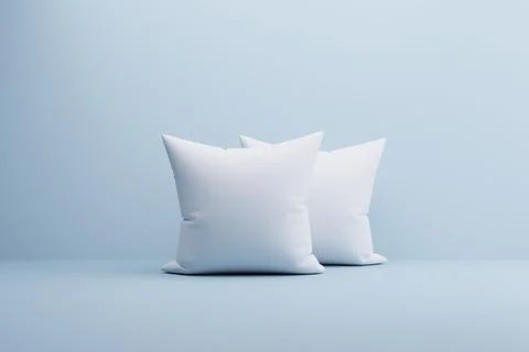 Two white pillows on light blue background, studio shot, mockup Stock Illustration
