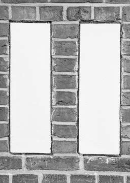 Two White Plaster Panels Framed by Red Brick  Geometric Faade Detail 写真素材