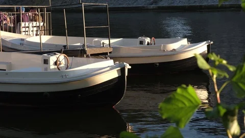 Two White plastic boats on a river at sunny day. Stock Footage 124245201