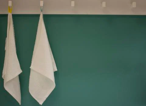 Two white polonets on a hanger Stock Photos