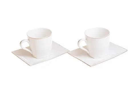 Two white porcelain tea, coffee cups with saucer. Isolated on white Stock Photos