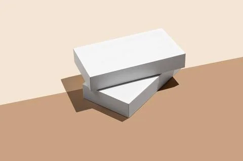Two white rectangular podium or boxes with shadow on diagonally divided yel.. 스톡 사진