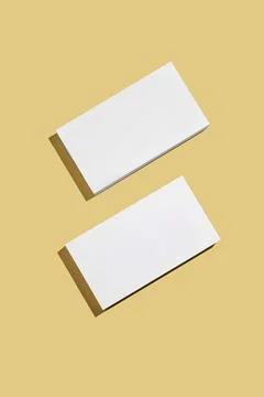 Two white rectangular podium or boxes with shadow on bright yellow background Fotos de archivo