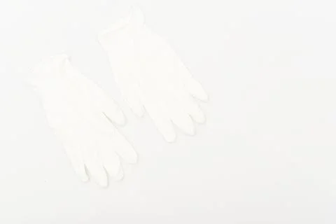 Two white rubber gloves isolated Stock Photos