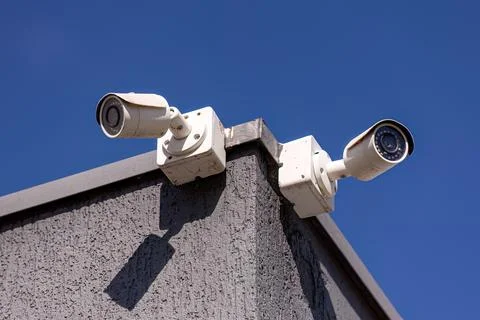 Two white security cameras Stock Photos