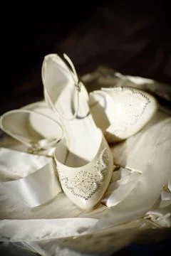 Two white shoes of the bride Stock Photos