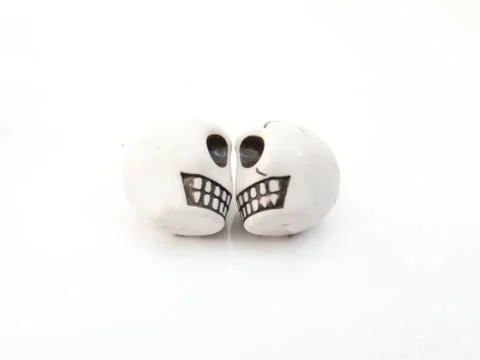 Two white skull on a white background for Halloween decorations. Stock Photos
