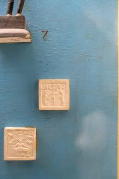 Two white tiles with a black border on a blue background. in Chennai Stock Photos