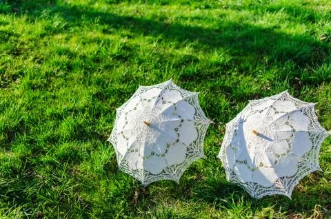 Two white umbrellas - wedding accessory Stock Photos
