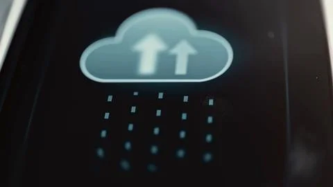 Two white upward arrows fill a blue cloud above a grid of glowing data blocks 库存照片