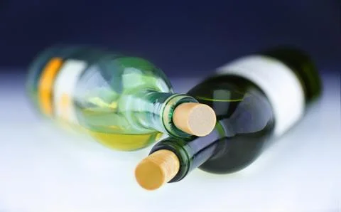 Two white wine bottles Stock Photos