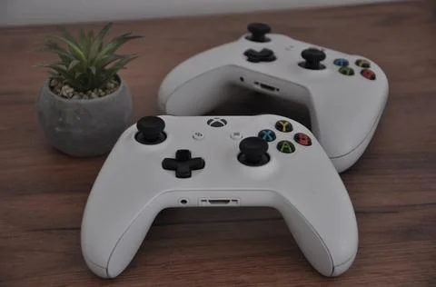 Two white Xbox One S controllers Stock Photos