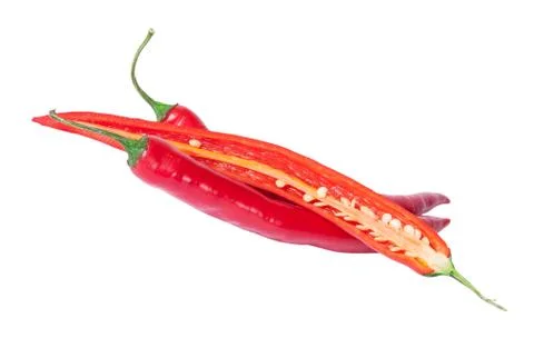 Two whole and one half red chili peppers deployed Stock Photos