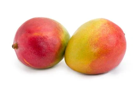Two whole mango fruit on a white background Stock Photos