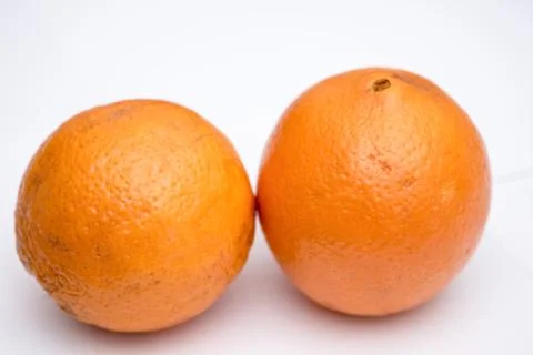 Two whole oranges on the white background 库存照片