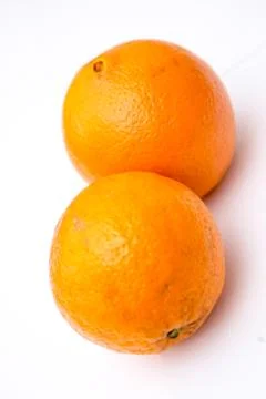 Two whole oranges on the white background Stock Photos