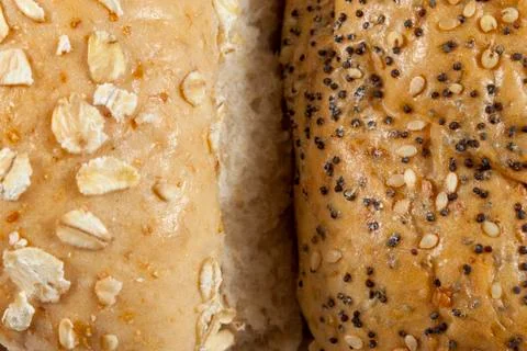 Two wholegrain seeded bread rolls side by side Stock-Fotos