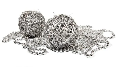 Two wicker balls and silver beads Stock Photos