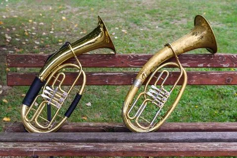 Two wind musical instruments on an old bench Stock Photos