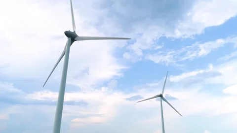 Two wind power turbines. Cloudy sky. Close-up drone footage Stock Footage 133001339
