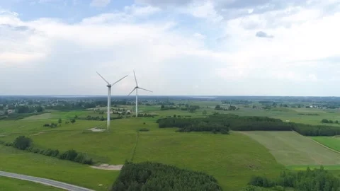 Two wind power turbines. Nice Aerial drone footage Stock Footage 133001225