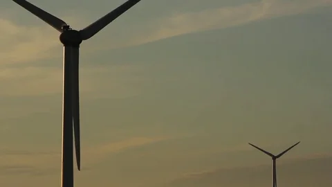 Two wind turbines evening sky Stock Footage 80789378