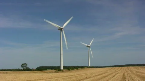 Two wind turbines on a field Video stock 518289