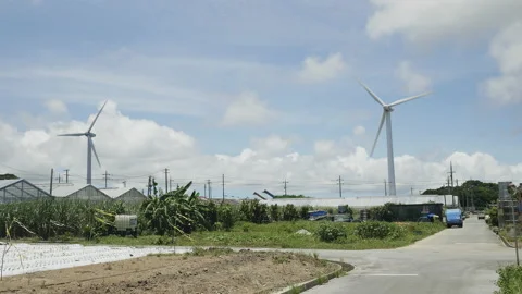 Two wind turbines in the field on a sunny day 스톡 동영상 157135772