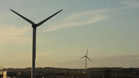 Two wind turbines ground visible Stock Footage 80789487