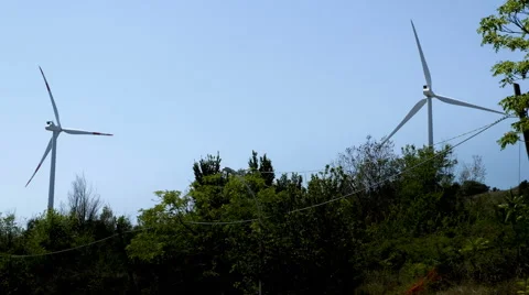 Two Wind turbines on the Italian hills Stock Footage
