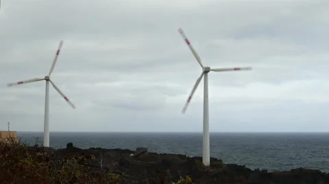 Two wind turbines oceanfront. Stock Footage 67383155
