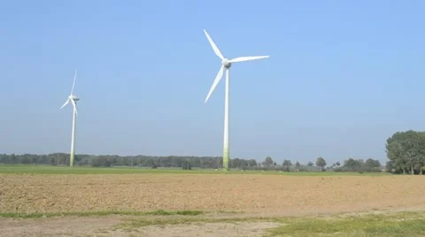 Two wind turbines in operation Stock Footage 11133499