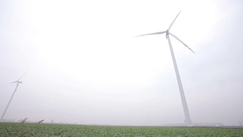 Two Wind Turbines Seen From Down Stock Footage 72397800