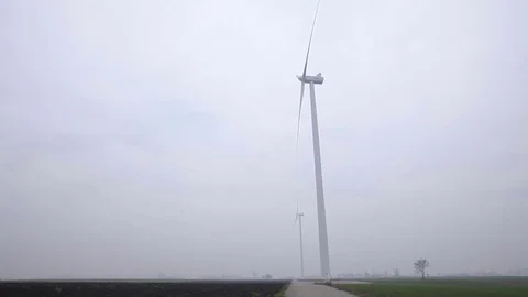 Two Wind Turbines Seen From the Side Stock Footage 72332522