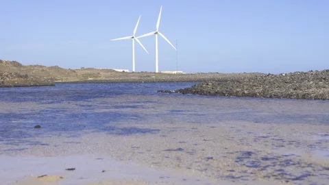 Two windmill rotating near sea coast Stock Footage 85813482