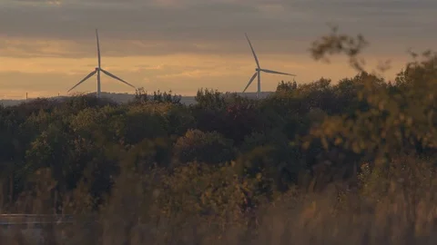 Two windmills during sunset. Production of ecological energy. Stock Footage 97410299