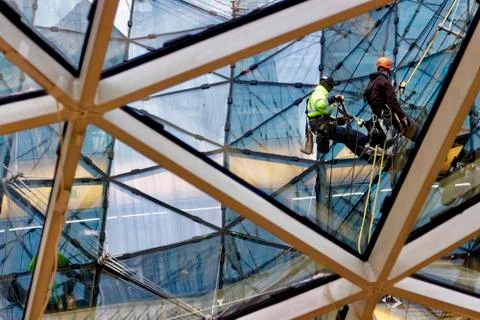 Two window cleaners at work Stock Photos