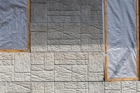 Two window frames are sealed with film Stock Photos