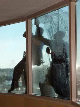Two window washers at work Fotos de archivo