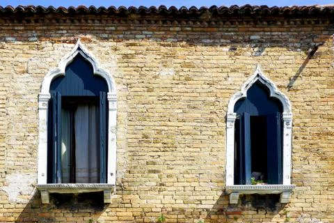 Two windows and ancient brick wall Stock Photos