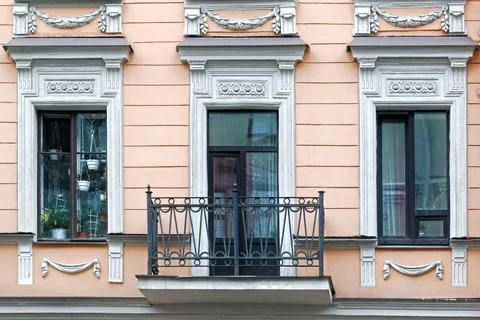 Two  windows and a balcony. Stock Photos