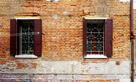 Two windows with brick decay wall building Stock Photos