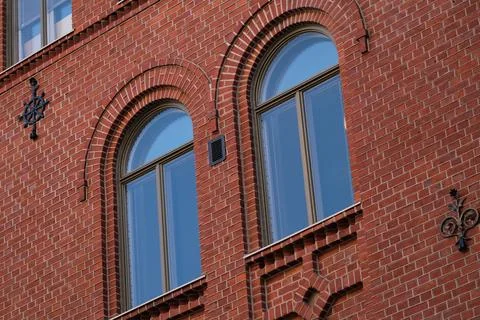 Two windows on a brick wall Stock Photos