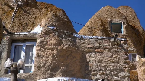 Two Windows Built Within Rock and Stone Stock Footage 100867053