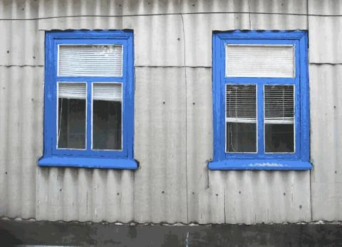 Two windows on the facade of the rustic house. Texture wall for background Stock Illustration