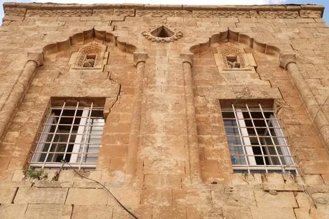 Two windows on the facade of a traditional house in the old town of Mardin, d Stock Photos